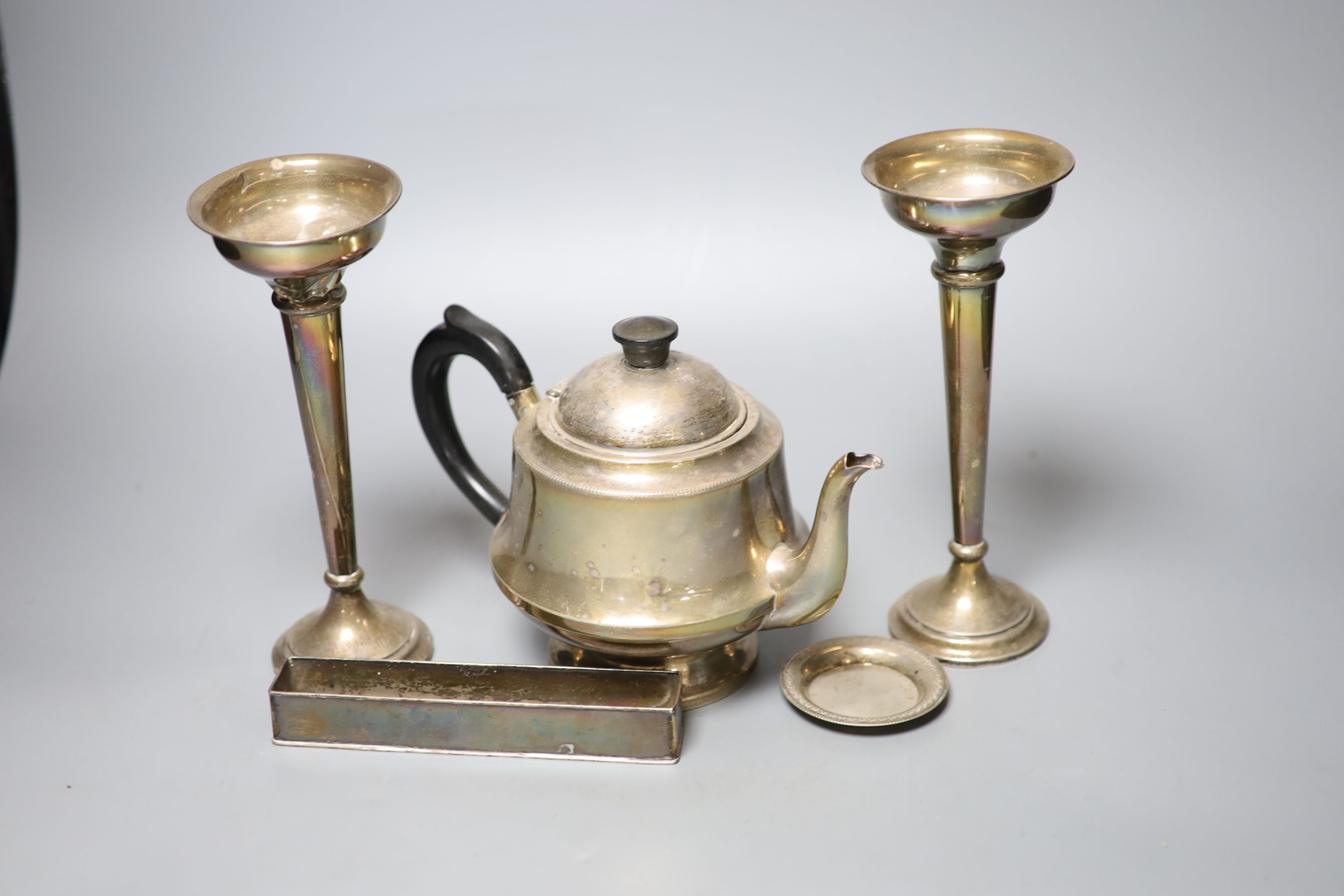 A 1930's silver teapot, a pair of silver mounted posy vases(a.f.), an Egyptian white metal small dish and a metal trough, weighable silver gross 11oz.